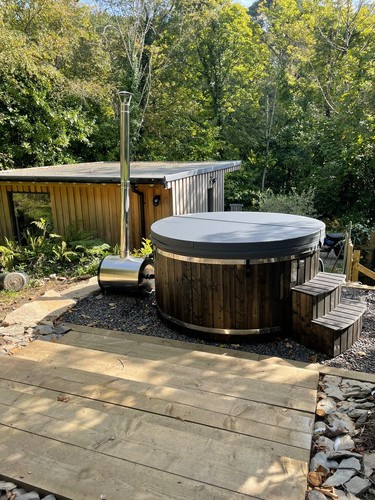 Wood fired hot tub with - , grade
